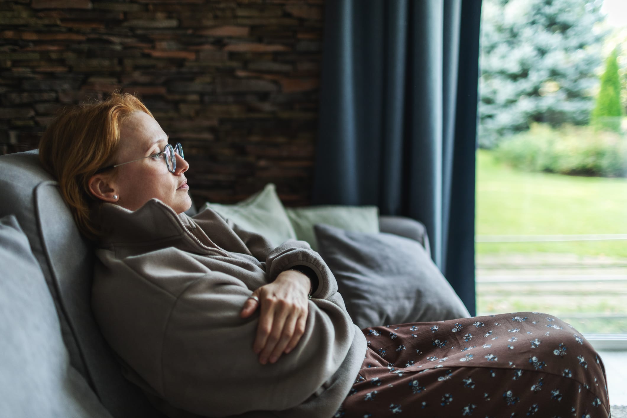 Tired woman sitting at home