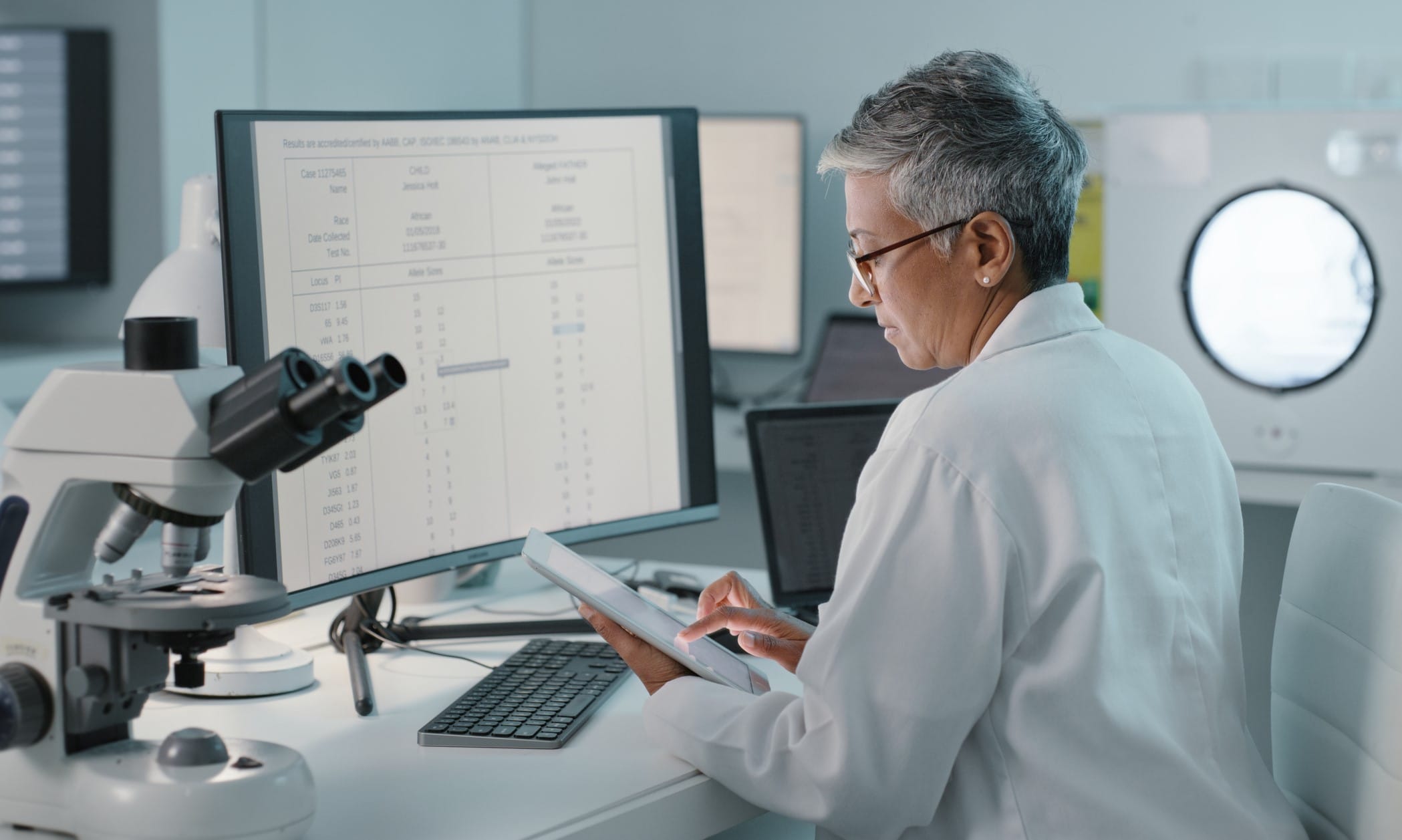 Researcher looking at data on a monitor