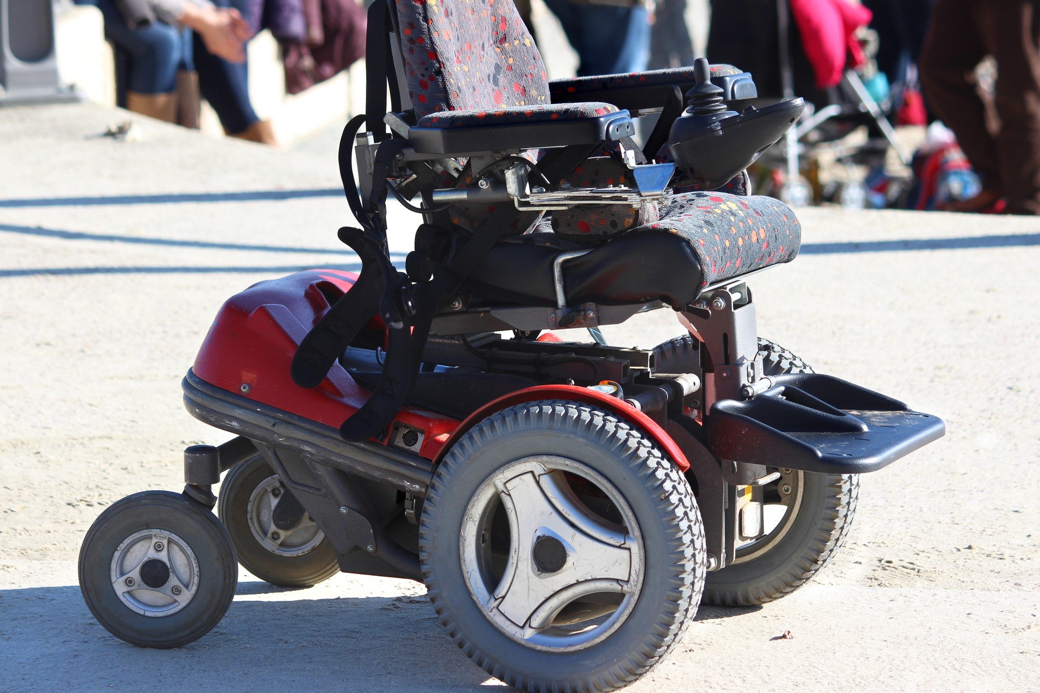 Image of empty power wheelchair outdoors