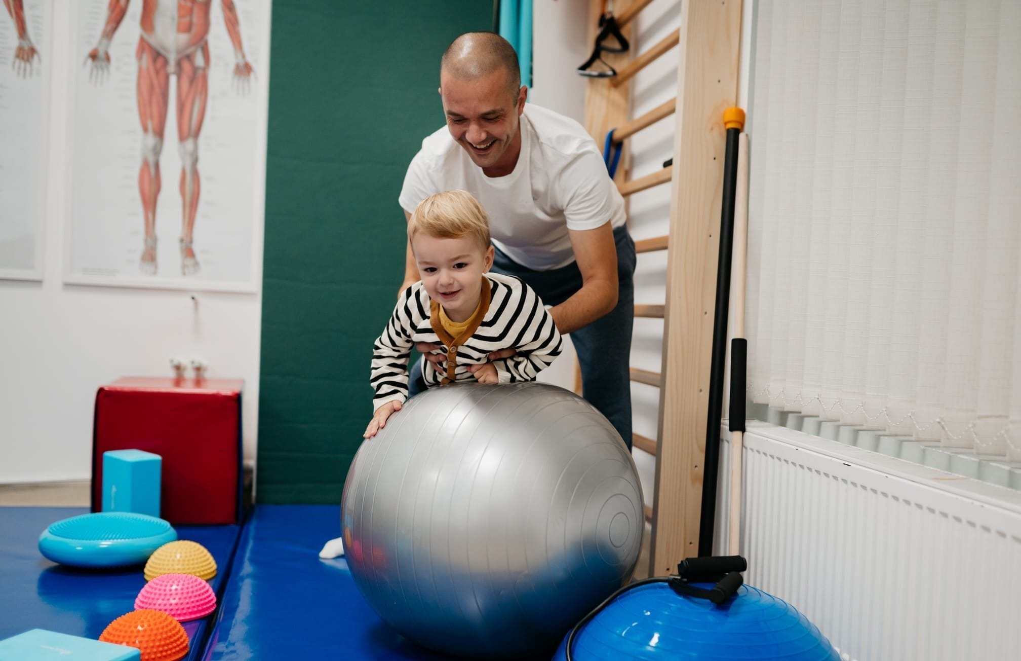 Little boy playing with his therapist