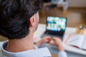 Photo shows a man in a virtual meeting/Getty Images
