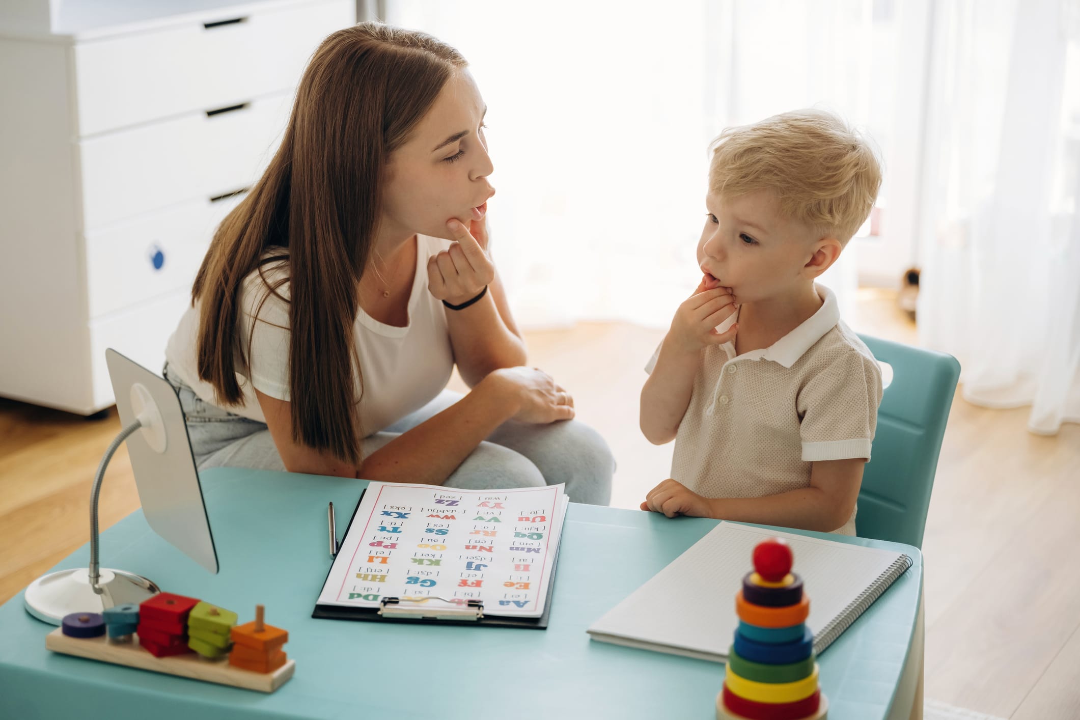 Speech therapist working with a small child